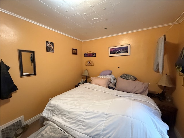 bedroom with ornamental molding