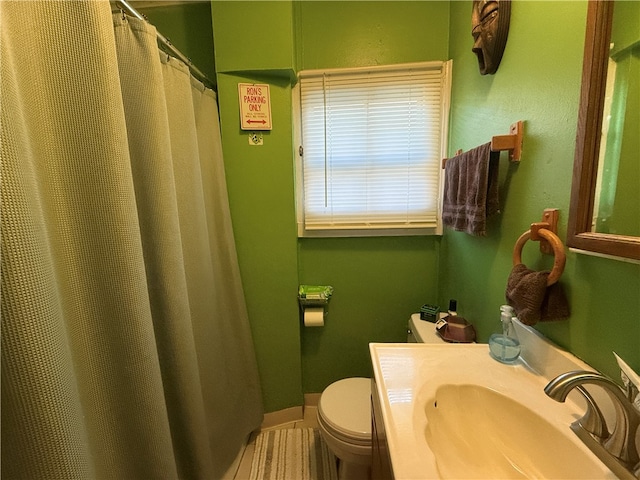 bathroom featuring sink and toilet