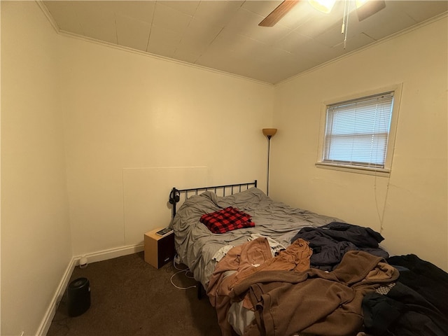 carpeted bedroom with ceiling fan and crown molding