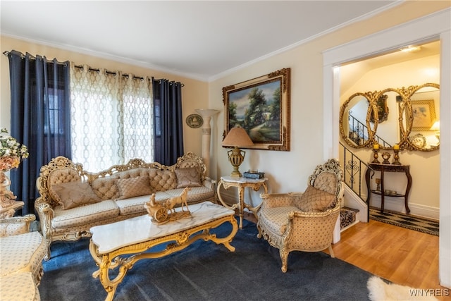 living room featuring wood-type flooring and ornamental molding