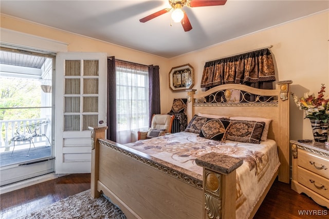 bedroom featuring dark hardwood / wood-style floors, ceiling fan, and access to exterior