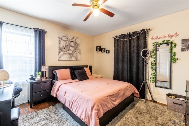 bedroom featuring ceiling fan and dark hardwood / wood-style floors