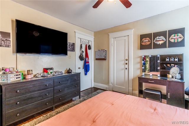 bedroom with a closet, ceiling fan, and dark hardwood / wood-style floors