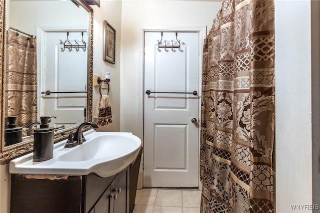 bathroom featuring tile patterned flooring and vanity