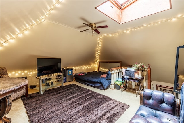 carpeted bedroom featuring vaulted ceiling with skylight