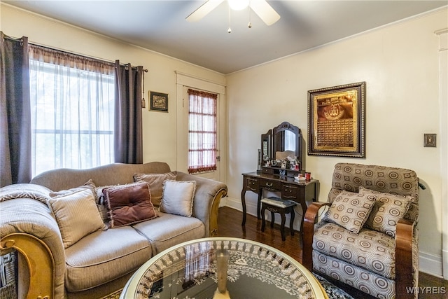 living room featuring dark hardwood / wood-style flooring, a wealth of natural light, and ceiling fan