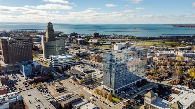 birds eye view of property with a water view