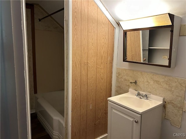 bathroom with shower / tub combination and vanity