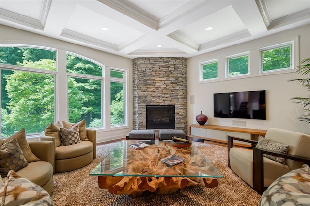 living room featuring beamed ceiling, coffered ceiling, a wealth of natural light, and a fireplace