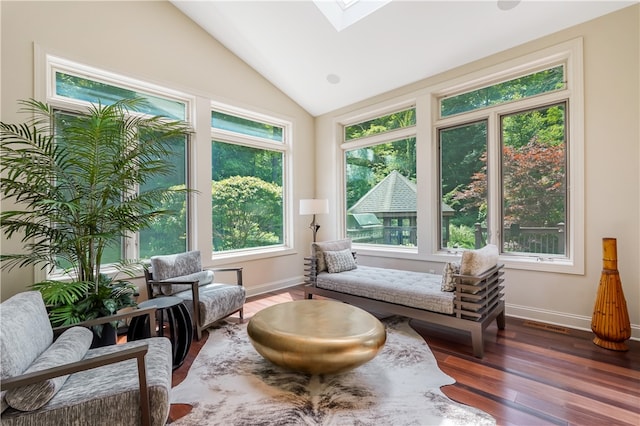 sunroom / solarium with a wealth of natural light and lofted ceiling with skylight