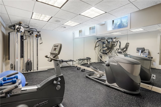 gym featuring a drop ceiling