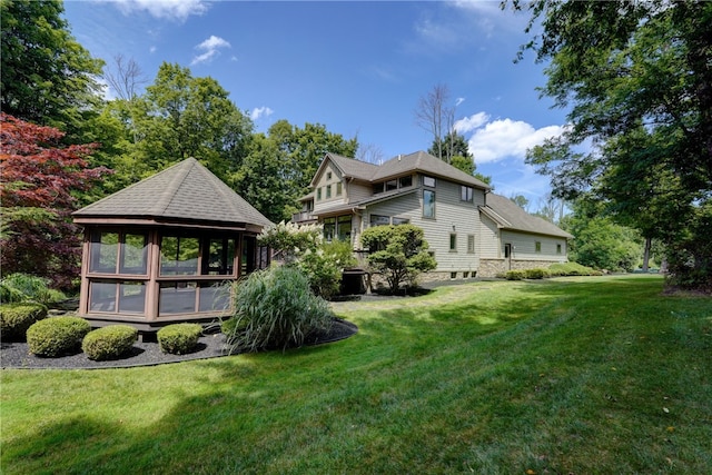 view of yard with a sunroom