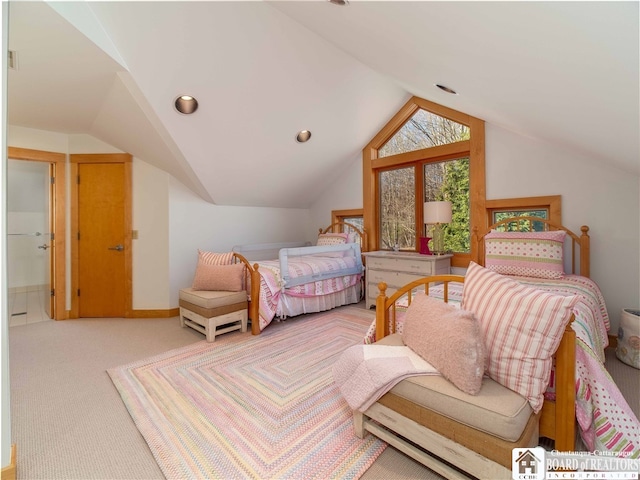 carpeted bedroom with vaulted ceiling