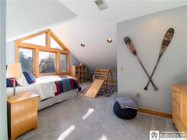 bedroom with lofted ceiling and carpet floors