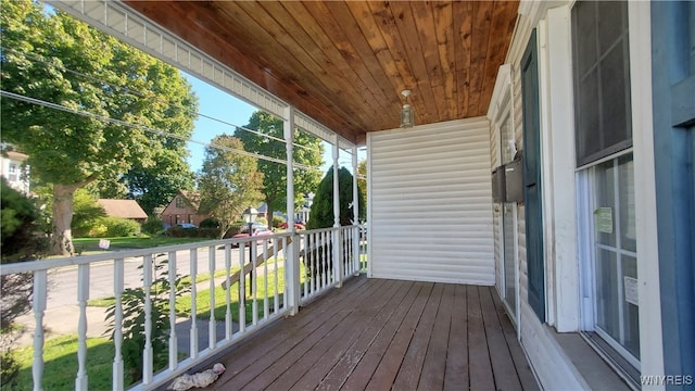 wooden terrace featuring covered porch