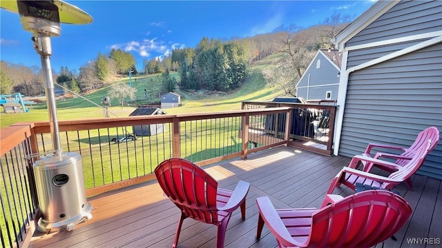 deck with an outbuilding and a yard