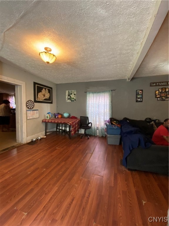 interior space with hardwood / wood-style flooring and a textured ceiling