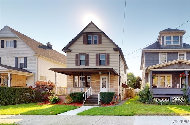 view of front of house featuring a front yard and a porch