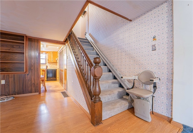 staircase with hardwood / wood-style flooring