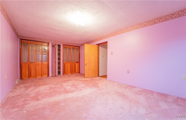 interior space with carpet and a textured ceiling