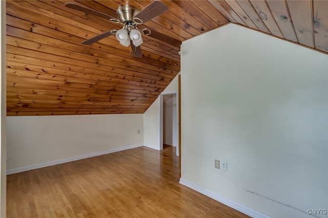 additional living space with light hardwood / wood-style floors, ceiling fan, vaulted ceiling, and wooden ceiling