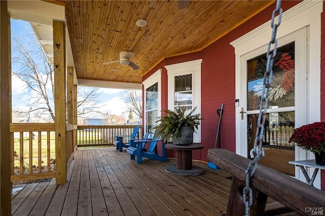 wooden terrace featuring ceiling fan