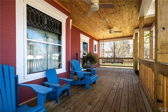 wooden terrace featuring ceiling fan and a porch