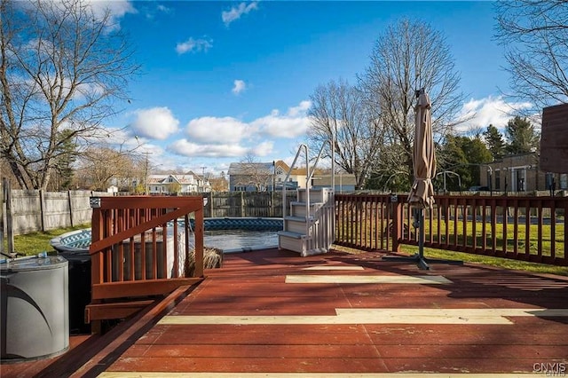 wooden deck with a covered pool