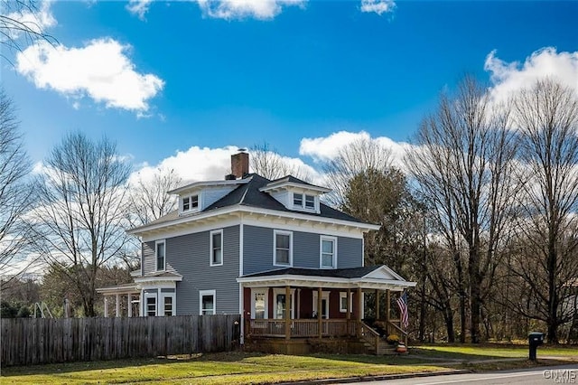 view of front facade featuring a porch and a front yard