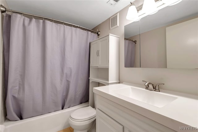 full bathroom featuring shower / bath combo, vanity, and toilet