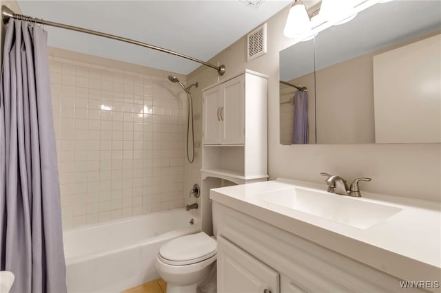 full bathroom featuring vanity, toilet, and shower / tub combo with curtain