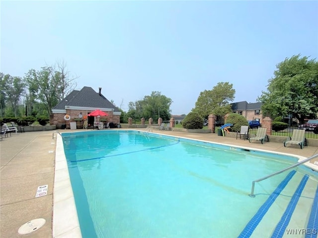 view of swimming pool featuring a patio area