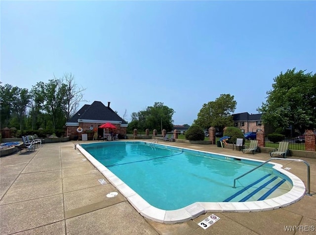 view of pool featuring a patio