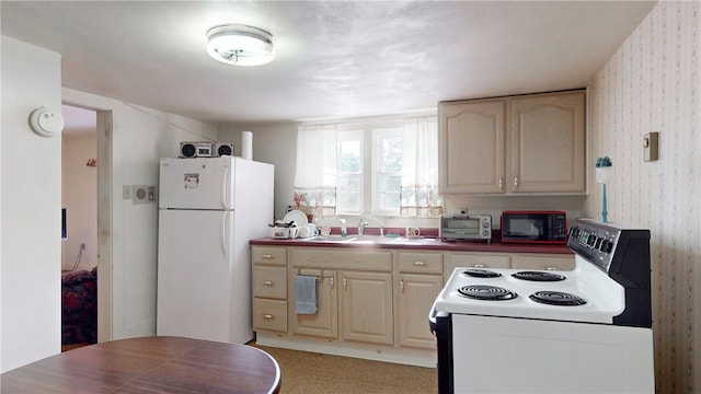 kitchen featuring sink and white appliances