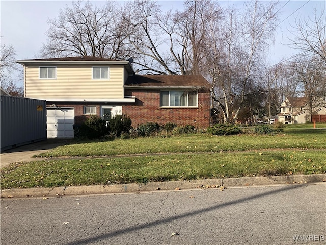 split level home with a garage and a front lawn