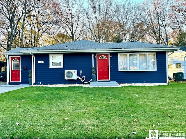 ranch-style house with ac unit and a front lawn