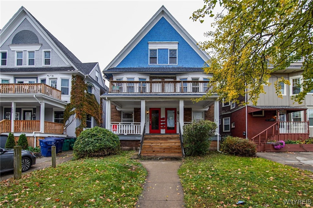 1034 Elmwood Ave, Buffalo, NY 14222 - victorian home featuring covered porch and a balcony