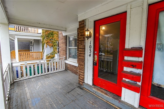 entrance to property featuring a porch