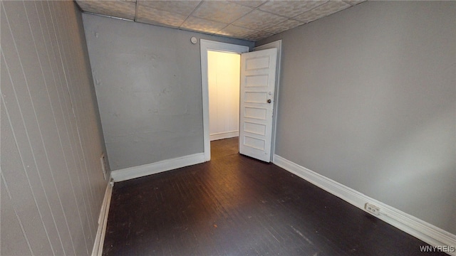 spare room with dark hardwood / wood-style flooring