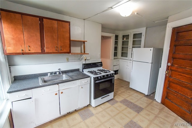 kitchen featuring white cabinets, white appliances, and sink