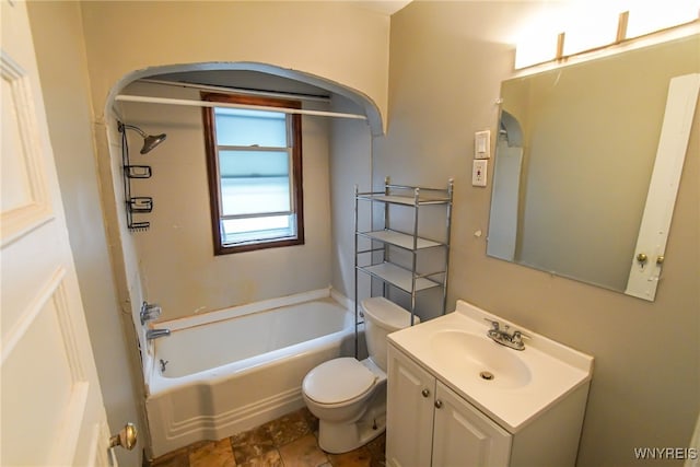 bathroom featuring vanity, toilet, and a tub