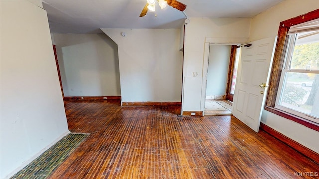 unfurnished room with ceiling fan and dark hardwood / wood-style floors