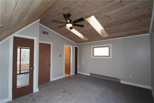 unfurnished bedroom with a baseboard radiator, visible vents, carpet flooring, vaulted ceiling with skylight, and wooden ceiling