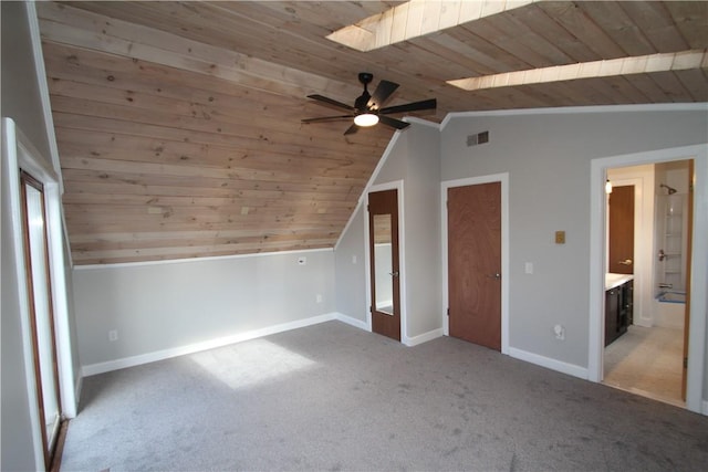 bonus room with wooden ceiling, vaulted ceiling with skylight, visible vents, and light colored carpet