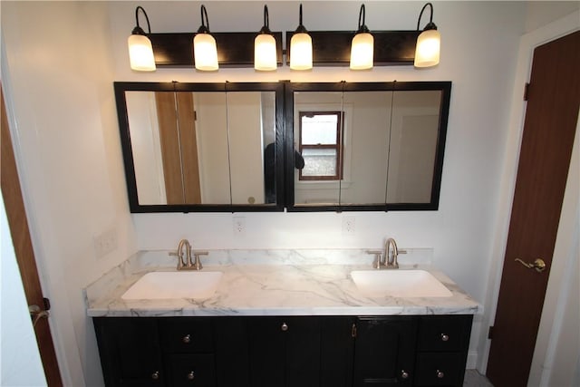 full bathroom featuring double vanity and a sink