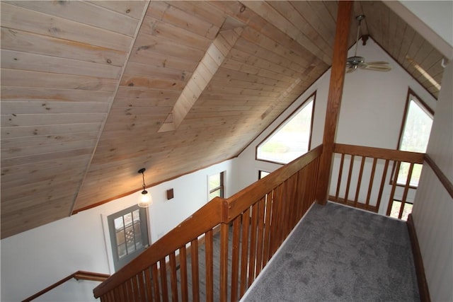 bonus room featuring lofted ceiling with beams, carpet, and wood ceiling