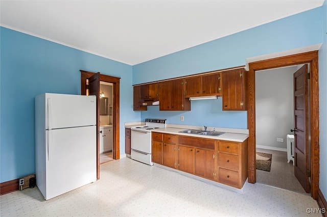 kitchen featuring sink and white appliances