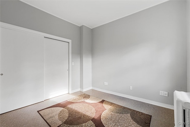 bedroom with carpet flooring and radiator