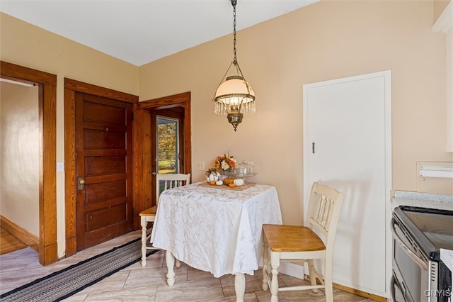 dining space with a chandelier