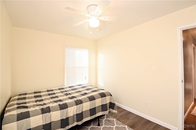 bedroom with ceiling fan and hardwood / wood-style floors